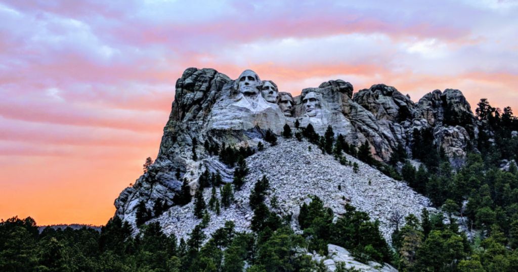 travel to view Mt. Rushmore in South Dakota