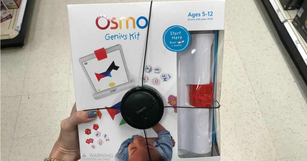 woman's hand holding Osmo Genius Kit in-store