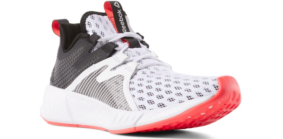 white Reebok running shoes wth black heel and red sole