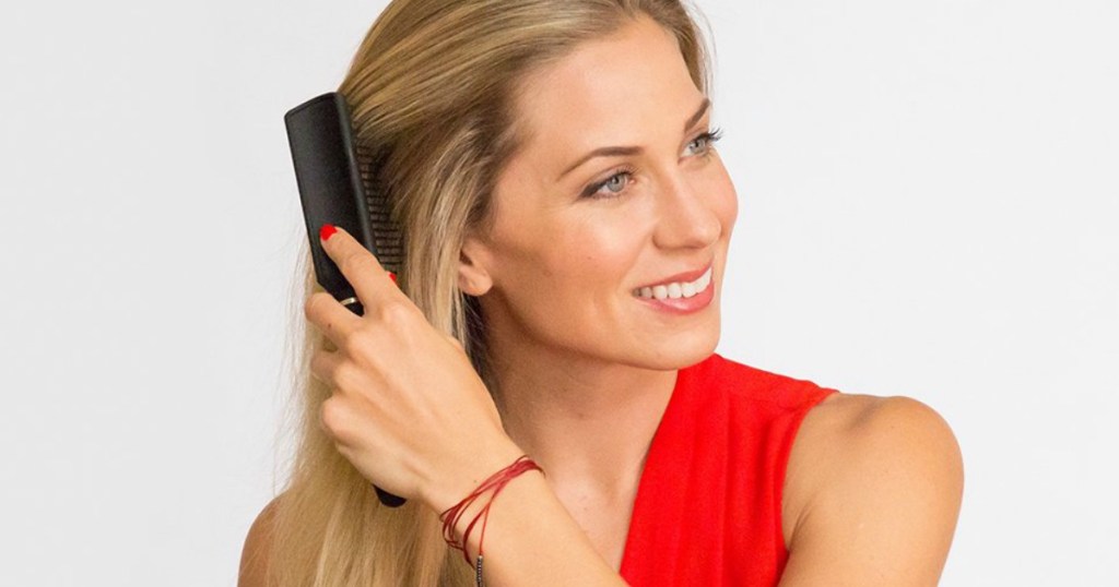 woman brushing her hair