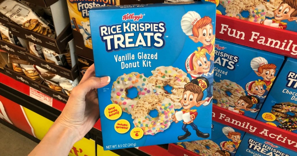 Woman holding Rice Krispies Donut Kit Treats at ALDI