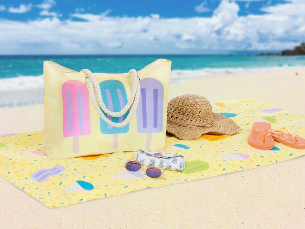 popsicle beach towel on the beach with a matching popsicle tote