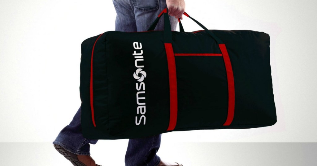 person holding Samsonite Duffel Bag