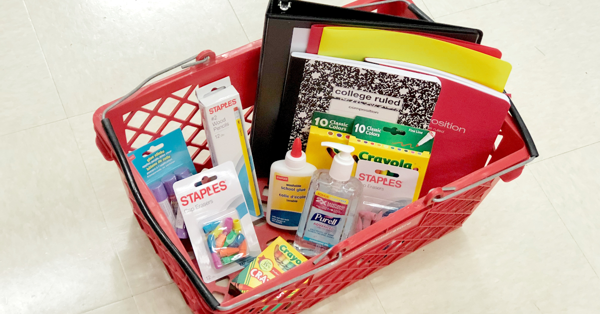 staples back to school supplies in a red staples basket sitting on the floor