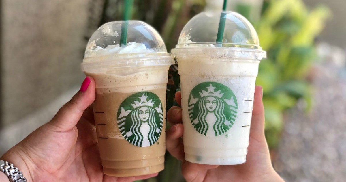 two Starbucks Frappuccinos being held outside