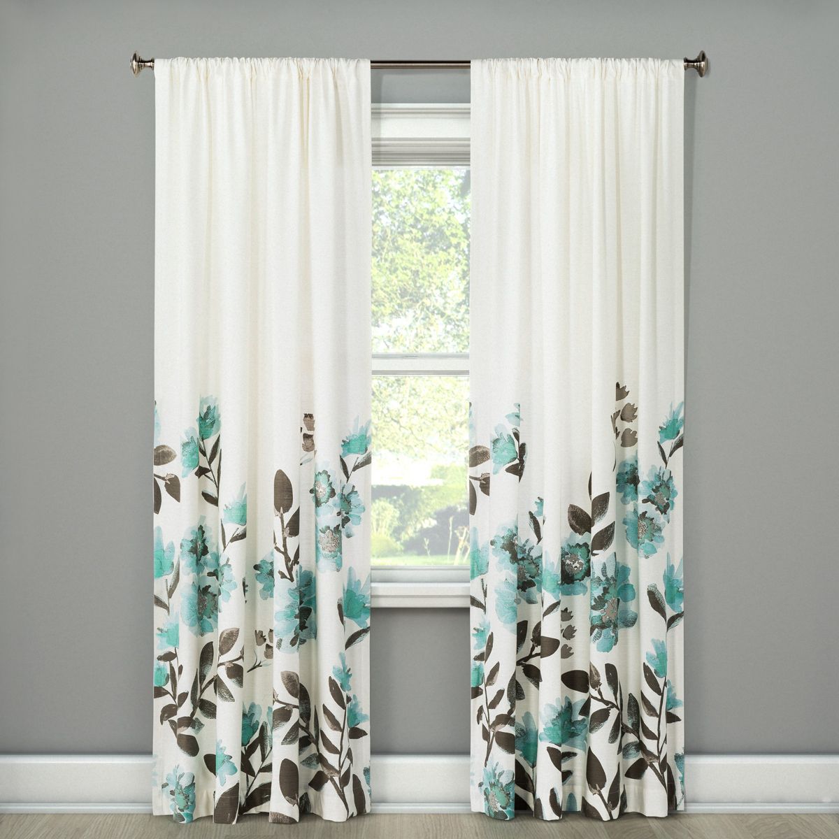 curtain panels with flowers climbing up hanging on window