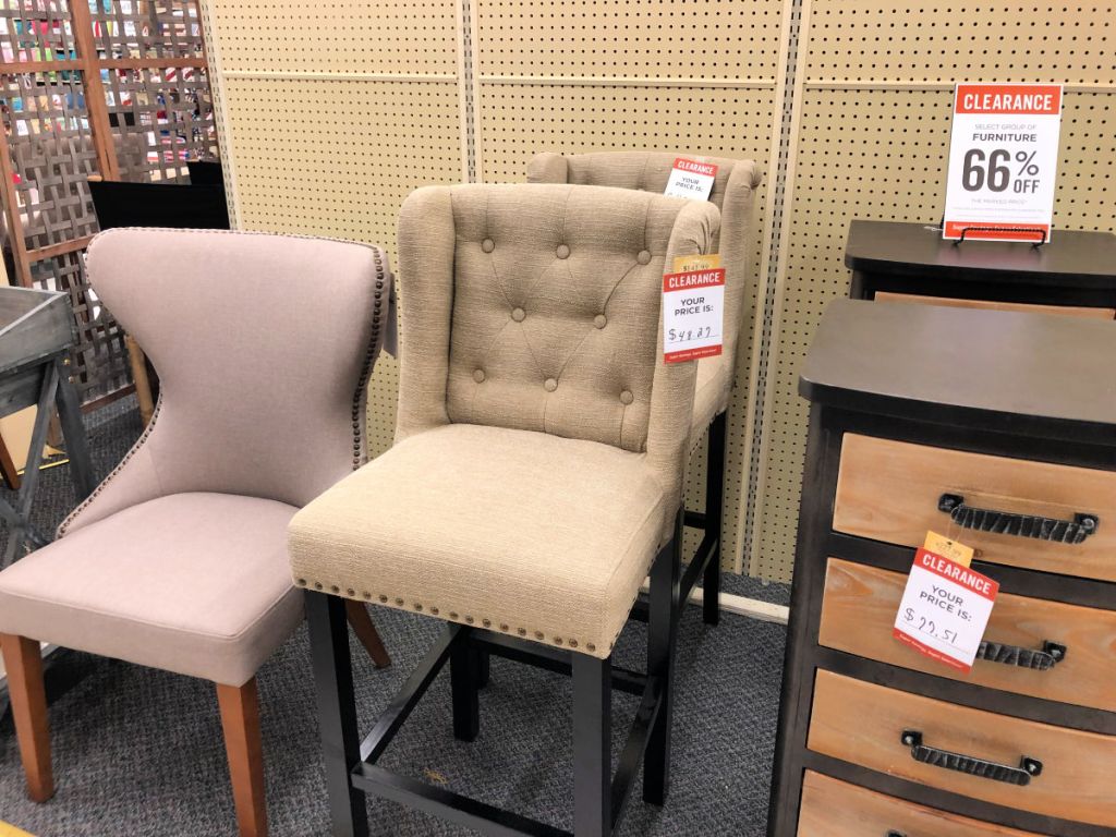 beige upholster high back chair in hobby lobby with tall storage drawers and mauve dining chair