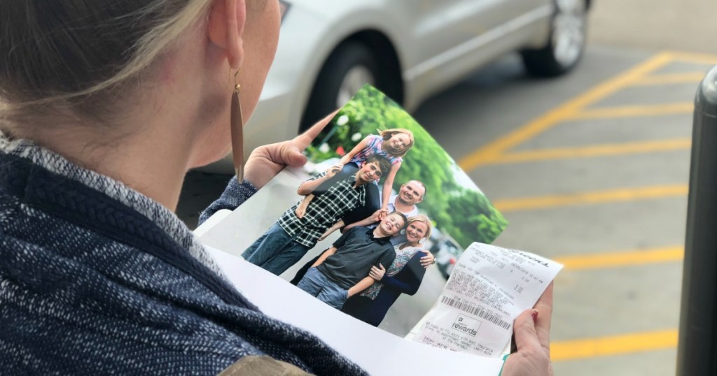 Collin holding photo of her family