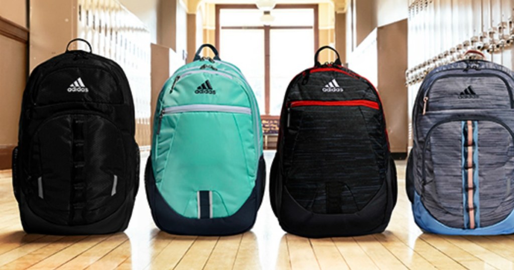 adidas backpacks displayed on school floor