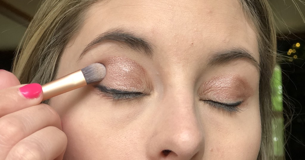 applying powder eyeshadow on top of cream shadow base