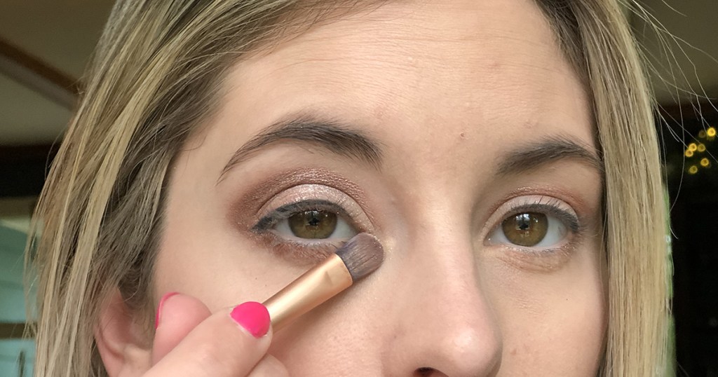 applying highlighter shadow to inner corners of eyes