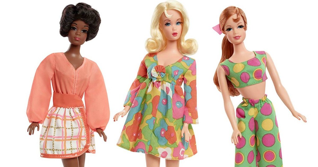 three barbies standing by each other