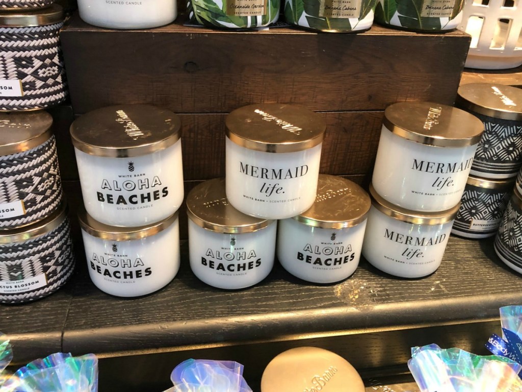 several candles on a table in store