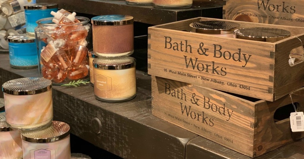 wood boxes with candles on shelves in store