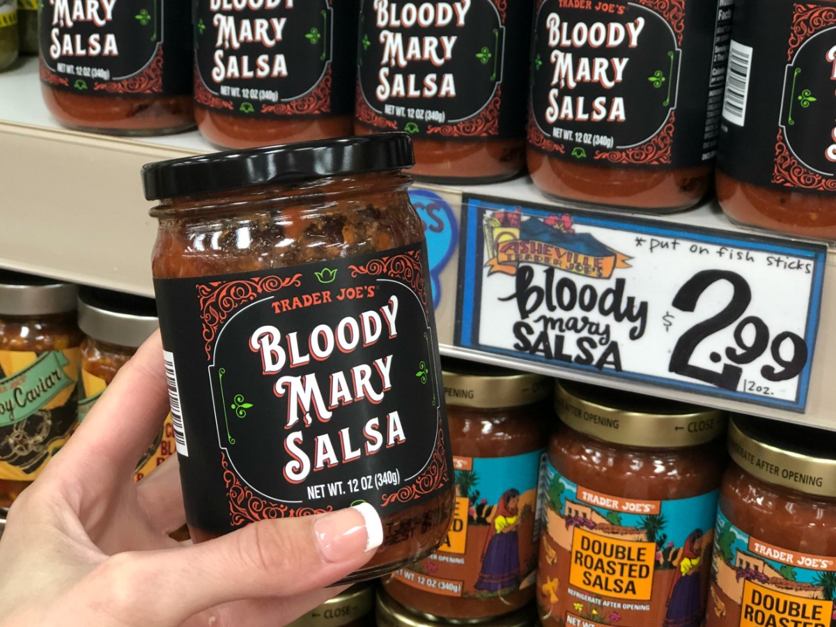 hand holding jar in store labeled bloody mary salsa