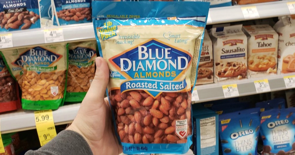 man holding big bag of blue diamond almonds