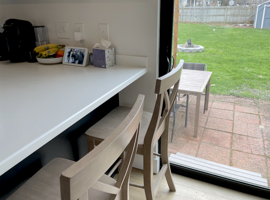 close up of barstools next to sliding glass door