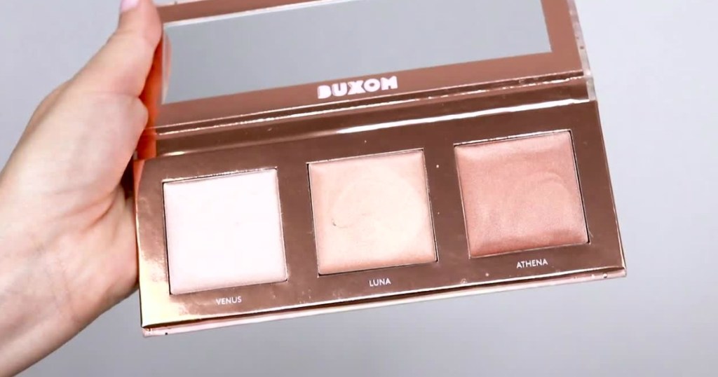 hand holding buxom highlighter palette open