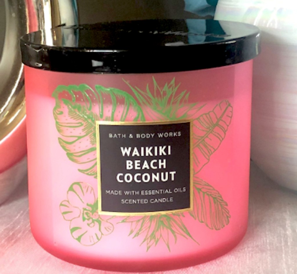 pink waikiki coconut candle with black lid