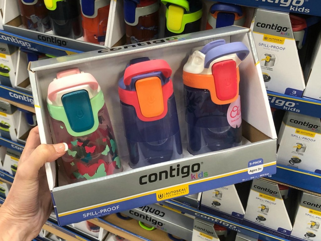 three colorful kids waterbottles in packaging in store