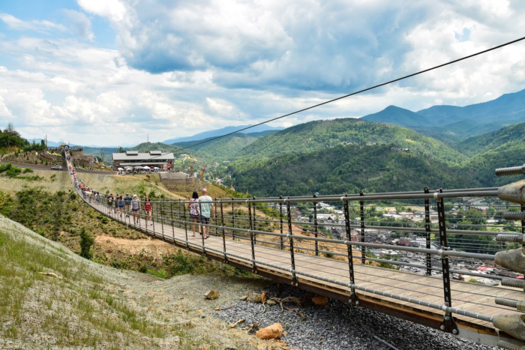 people walking across suspension bridge in gatlinburg tennessee