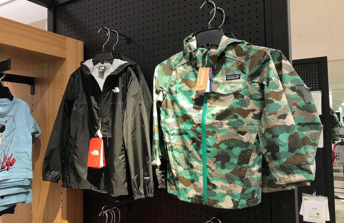 black north face jackets and camo patigonia coats hanging on racks
