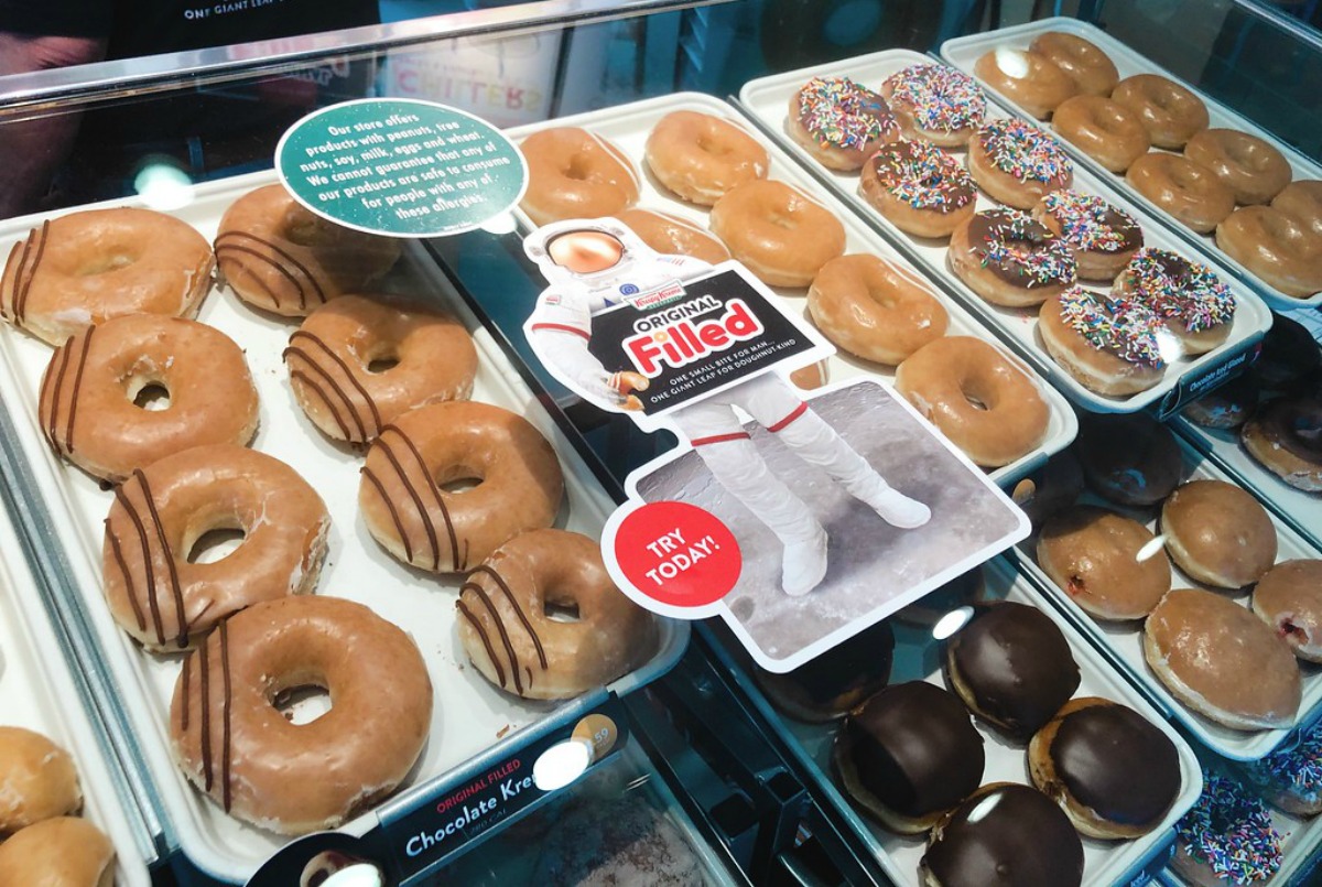 racks of Krispy Kreme doughnuts in store