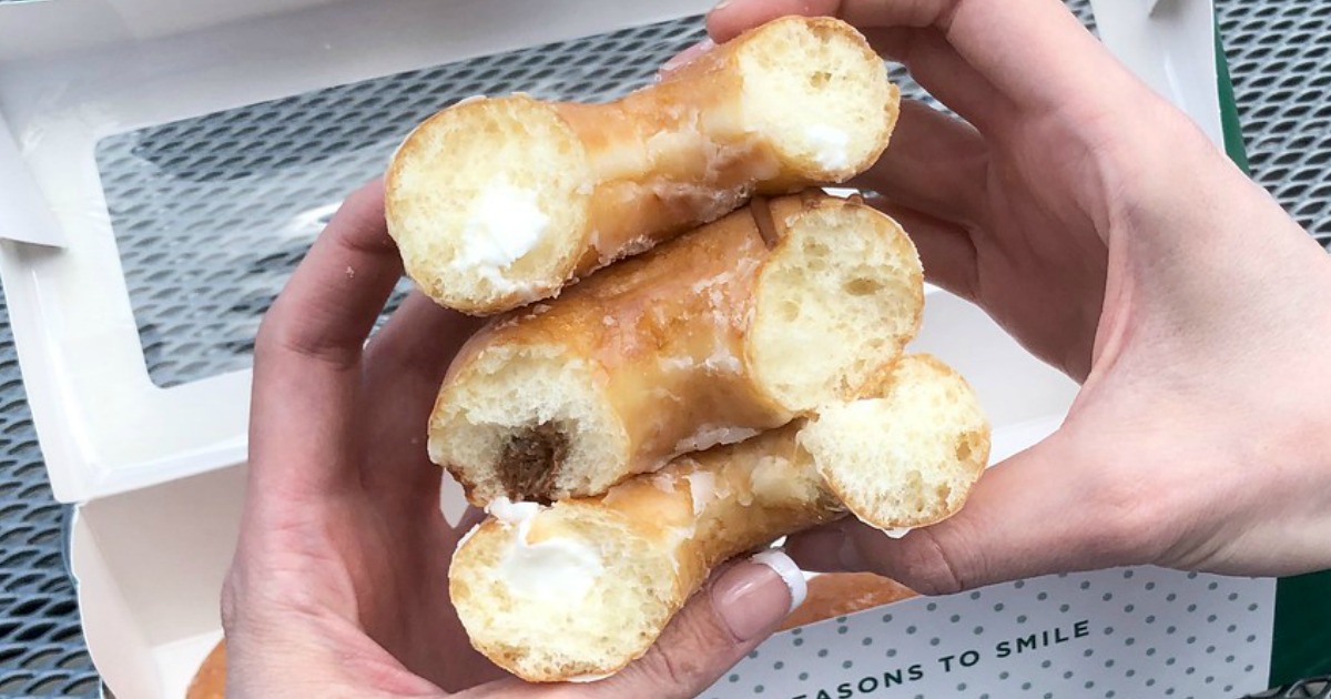 three stacked donuts cut in half showing the filling
