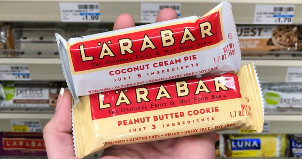 hand holding two larabar bars in store