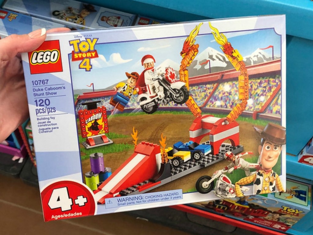 hand holding lego set at store display