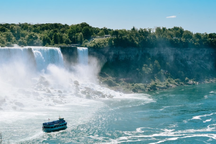 boat in water at the base of cheap family vacation spot niagara falls