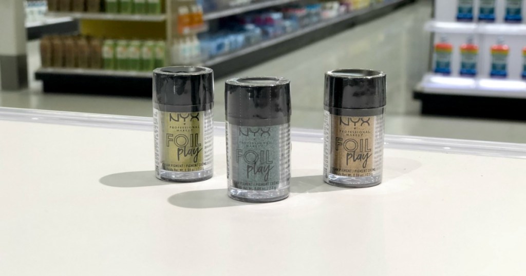 3 nyx foil play bottles on display on table at store