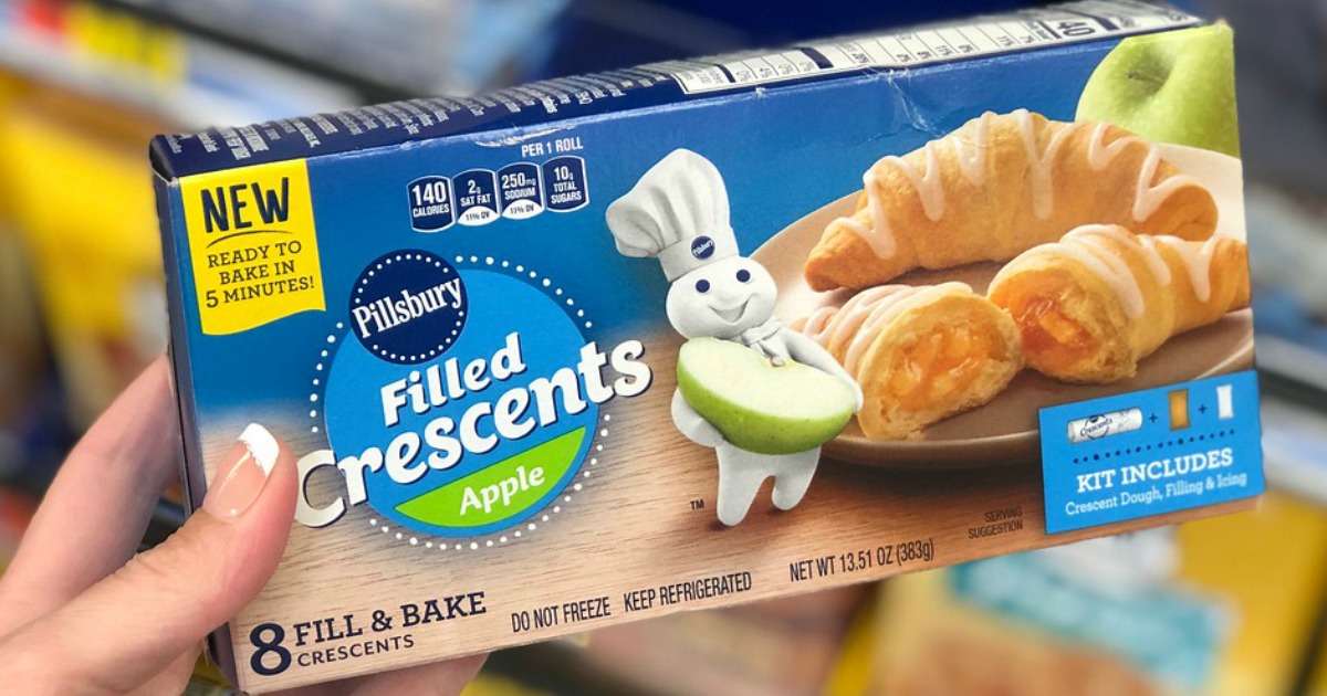 hand holding box of pillsbury filled crescents apple flavored pastries