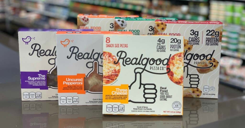 six realgood pizza boxes displayed on counter