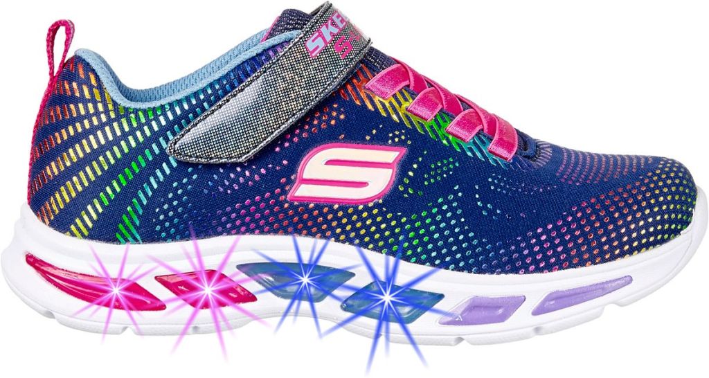 Navy kid's Skechers shoes with multi-colored dash design, pink laces, and lights across the bottom of the shoe