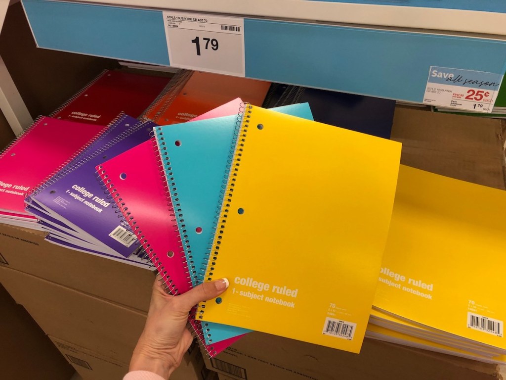 hand fanning spiral notebooks