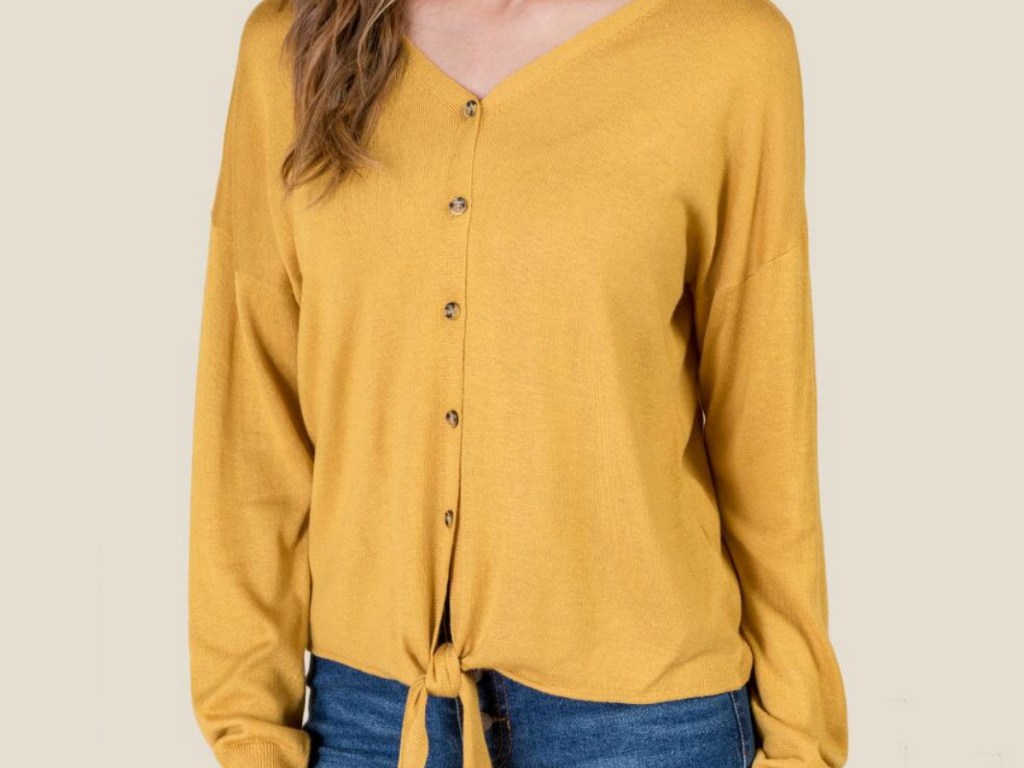 woman wearing yellow sweater