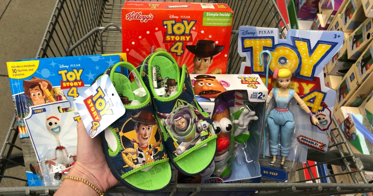 Woman holding pair of Toy Story 4 Children's Beach Sandals with other Toy Story items