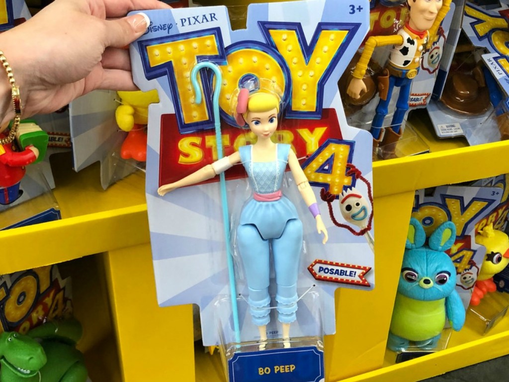 hand holding kids toy by store display