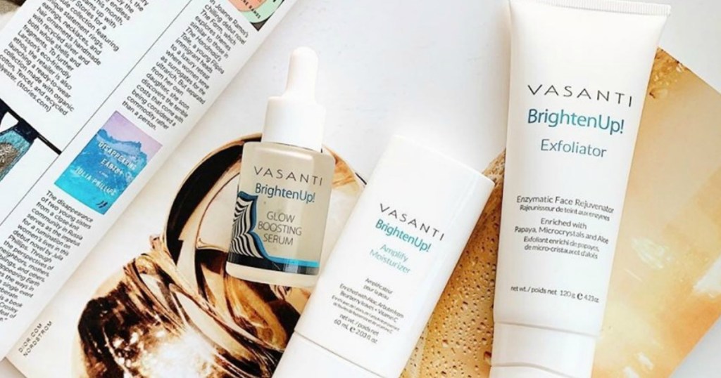 three face cleaning products sitting on a magazine