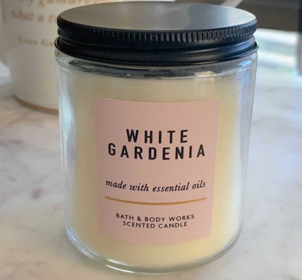 photo of white gardenia candle on countertop
