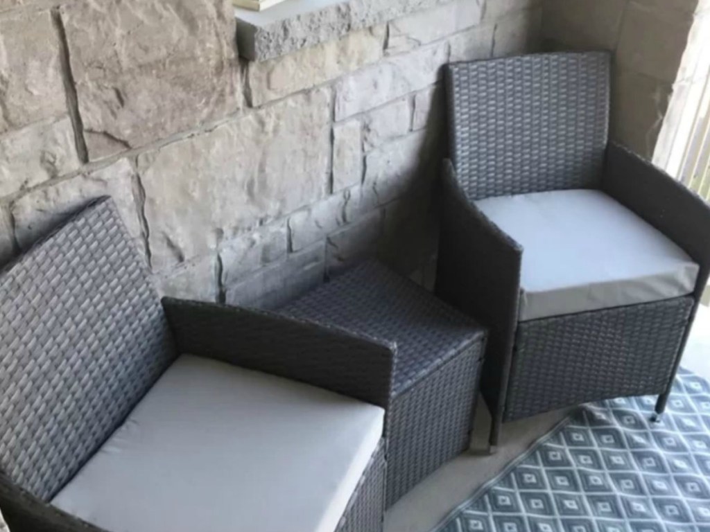 small patio with 2 grey chairs and little table