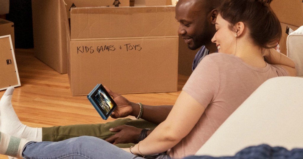 woman holding Amazon 7 Fire Tablet