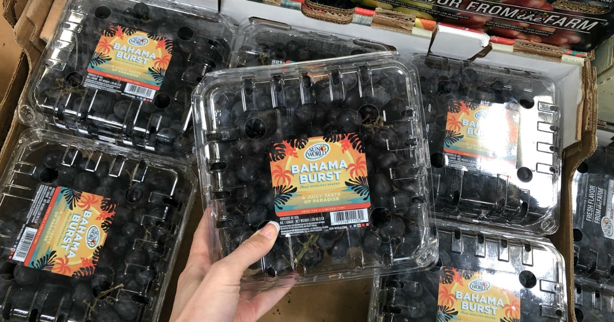 Woman holding Bahama Burst grapes at Sam's Club