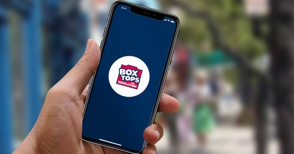 man holding cell phone with Box Tops for Education logo on the screen