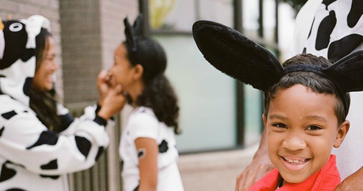 Boy and family dressed in cow attire for Chick-Fil-A Cow Appreciation Day