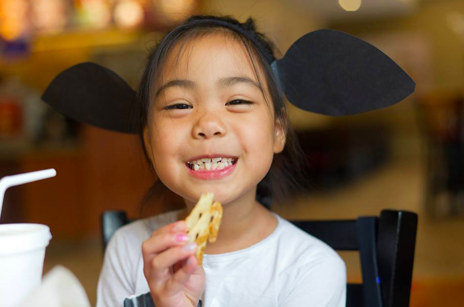 Girl dressed in cow attire for Chick-Fil-A Cow Appreciation Day