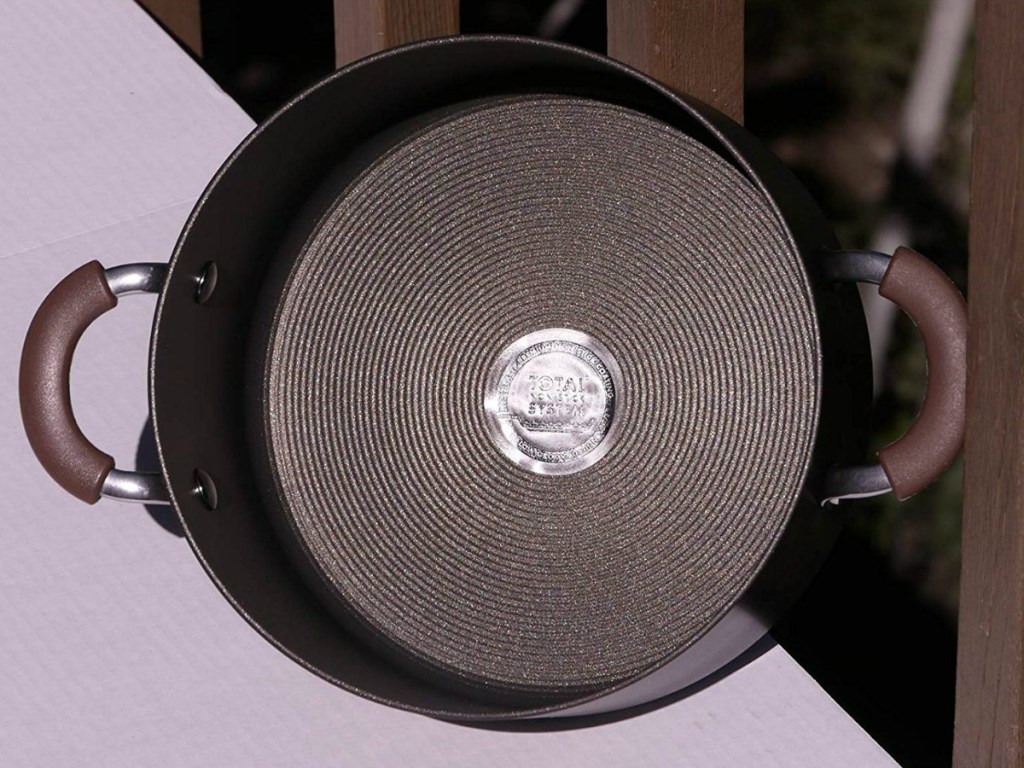 view of the inside of a dutch oven with total nonstick sticker on bottom