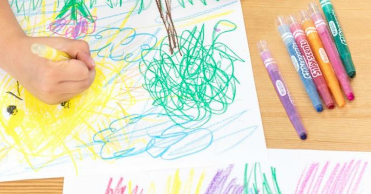 Kid drawing picture with Crayola Silly Scents Twistable Crayons