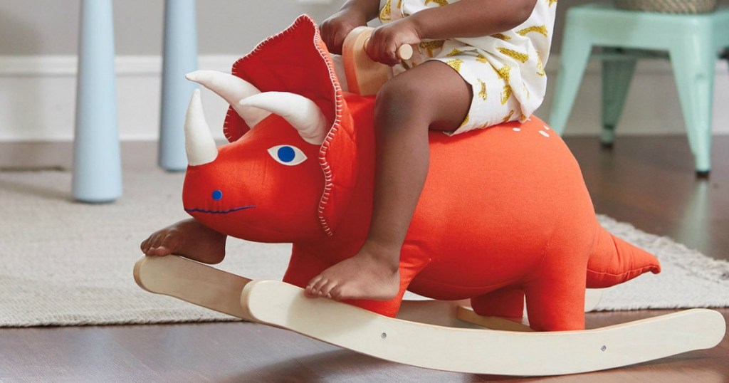 toddler kid rocking on rhino rocker